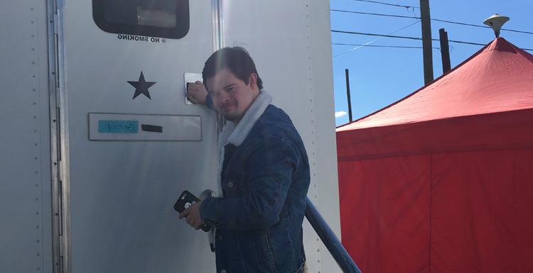 Former 南 student Benjamin Pelham outside of his trailer on the set of the film "Embattled."